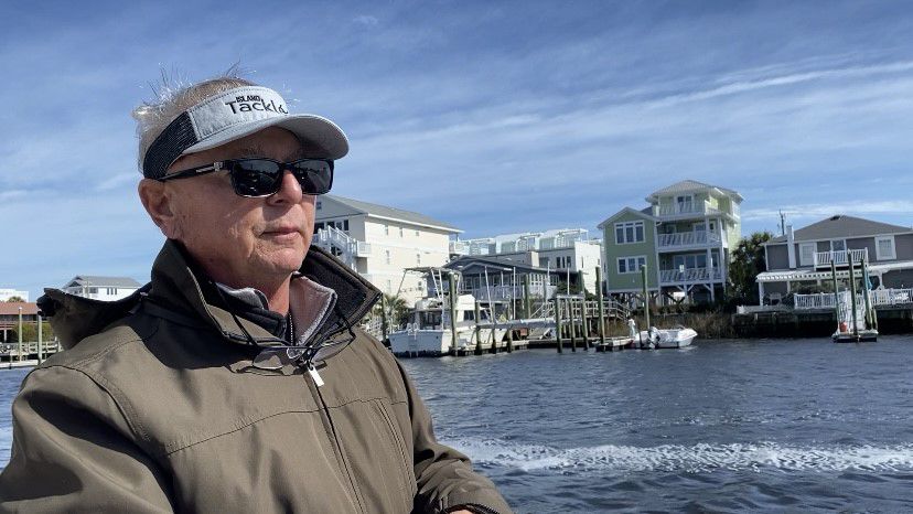 Dennis Barbour, who survived a heart attack last year, loves fishing in Carolina Beach. (Spectrum News 1/Natalie Mooney)